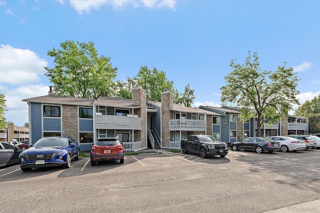 8335 Fairmount Dr Unit 2-105, Denver, CO 80247 - view of property featuring uncovered parking
