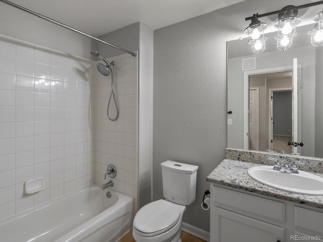 7131 S Wenatchee Way Unit C, Aurora, CO 80016 - bathroom featuring vanity, shower / bathtub combination, and a textured wall