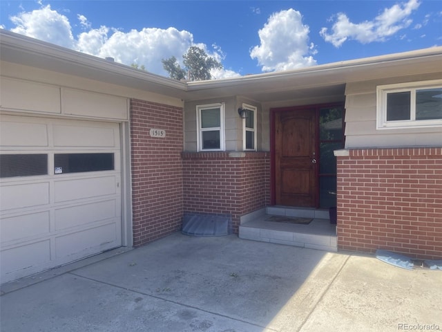 doorway to property featuring a garage