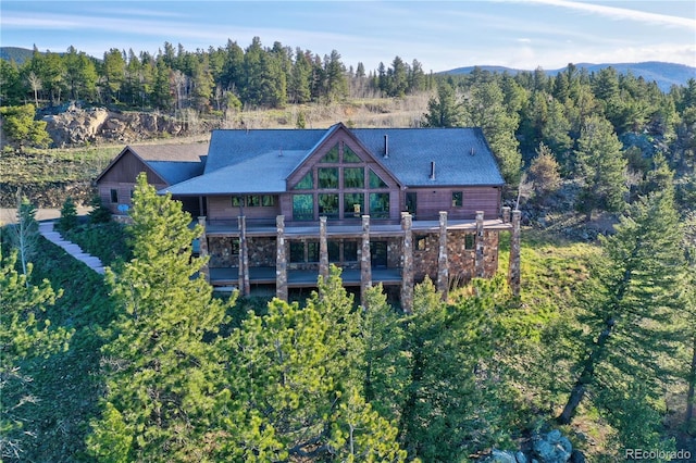 back of property with a mountain view