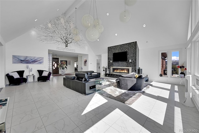 living room featuring a fireplace, beam ceiling, and high vaulted ceiling