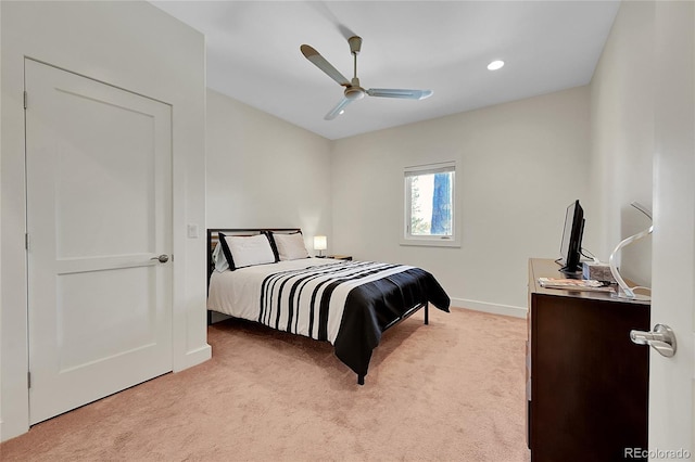 bedroom with ceiling fan and light colored carpet