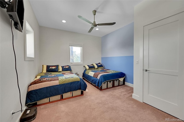 carpeted bedroom with ceiling fan