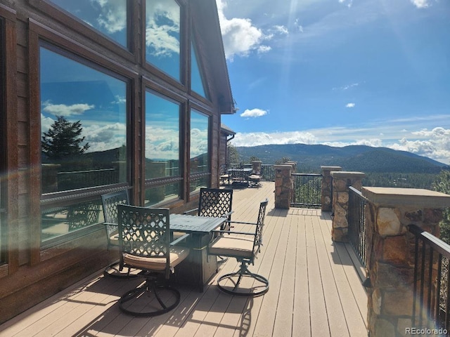 wooden terrace featuring a mountain view