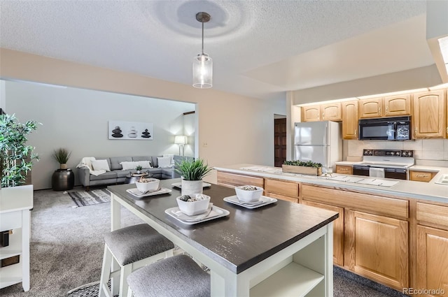 dining area with dark carpet and a textured ceiling