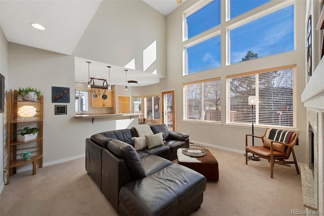 carpeted living room with a high ceiling