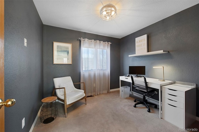 office with light carpet and a textured ceiling