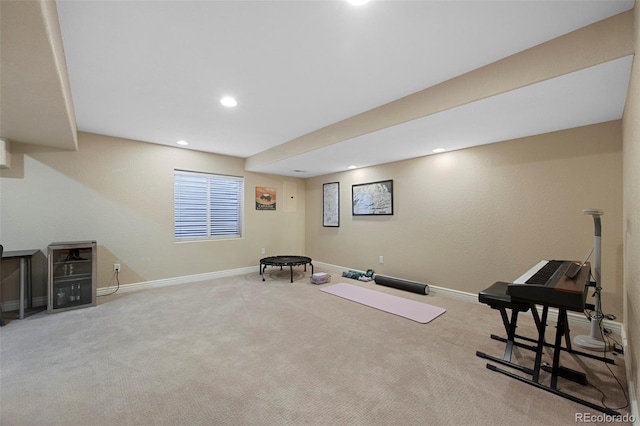 workout area featuring light carpet