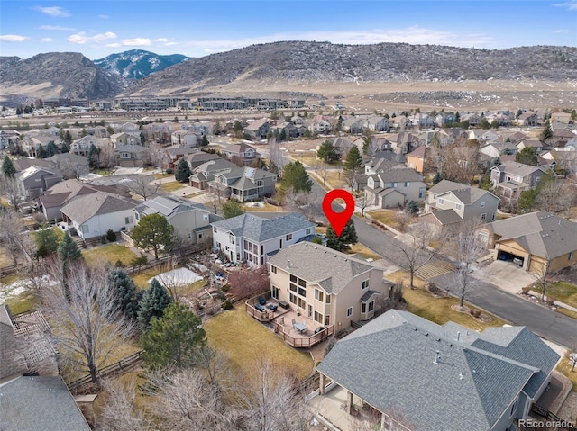 birds eye view of property featuring a mountain view