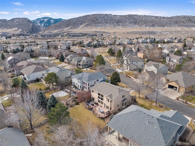 birds eye view of property with a mountain view