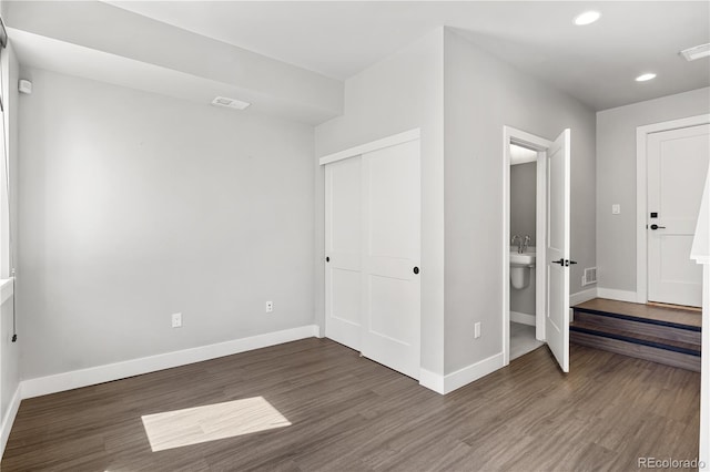 3820 N Olive St Unit 2, Denver, CO 80207 - unfurnished bedroom featuring wood finished floors, a closet, and recessed lighting