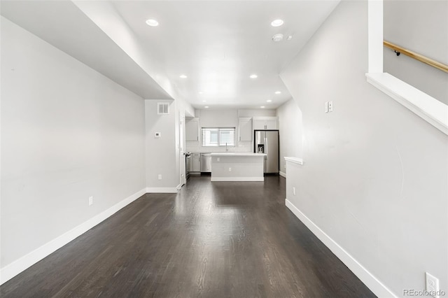 3820 N Olive St Unit 2, Denver, CO 80207 - unfurnished living room featuring recessed lighting and dark wood-style flooring