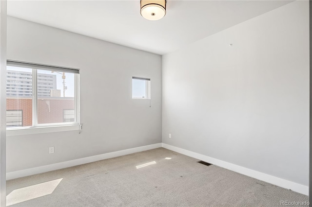 3820 N Olive St Unit 2, Denver, CO 80207 - carpeted empty room featuring baseboards