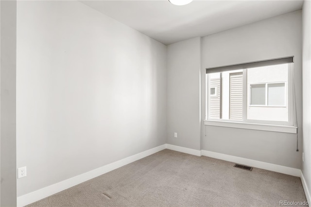 3820 N Olive St Unit 2, Denver, CO 80207 - unfurnished room with light carpet and baseboards
