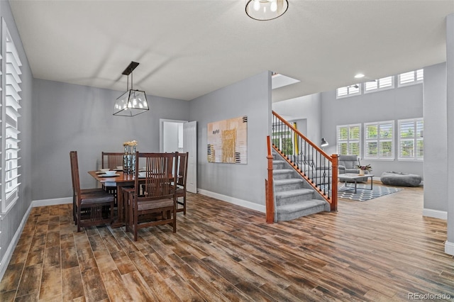 24682 E Ontario Dr, Aurora, CO 80016 - dining area with dark wood-type flooring and baseboards