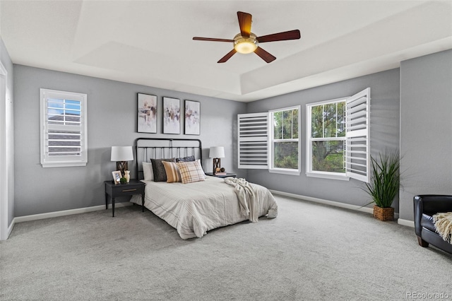 24682 E Ontario Dr, Aurora, CO 80016 - bedroom featuring a raised ceiling, carpet floors, and multiple windows