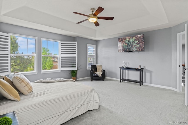 24682 E Ontario Dr, Aurora, CO 80016 - carpeted bedroom with a tray ceiling, baseboards, and a ceiling fan