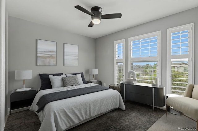 24682 E Ontario Dr, Aurora, CO 80016 - bedroom featuring dark colored carpet and a ceiling fan