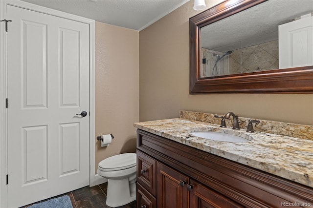 24682 E Ontario Dr, Aurora, CO 80016 - bathroom with vanity, toilet, and a textured ceiling