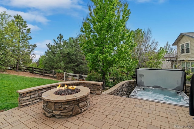 24682 E Ontario Dr, Aurora, CO 80016 - view of patio / terrace featuring an outdoor fire pit and a covered hot tub