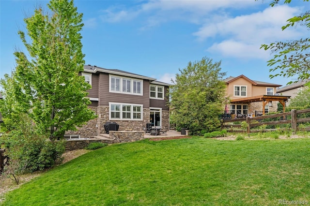 24682 E Ontario Dr, Aurora, CO 80016 - rear view of property with stone siding and a patio area