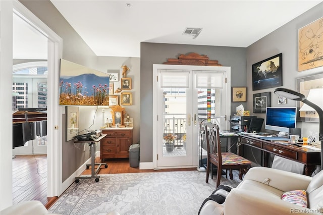 office area with light hardwood / wood-style floors