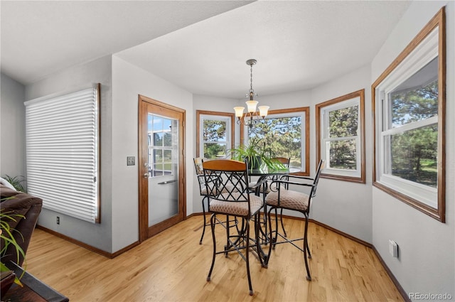 17815 Saddlewood, Monument, CO 80132 - dining room featuring a chandelier and light wood-style flooring