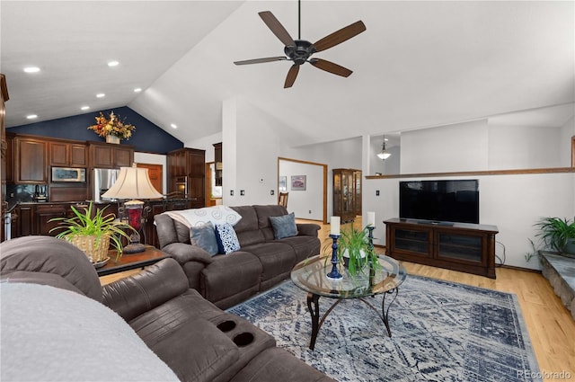 17815 Saddlewood, Monument, CO 80132 - living room with ceiling fan, light wood finished floors, and high vaulted ceiling