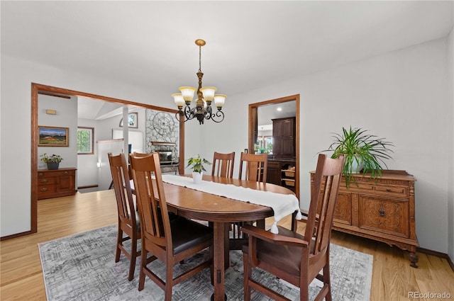 17815 Saddlewood, Monument, CO 80132 - dining space with a chandelier and light wood-type flooring