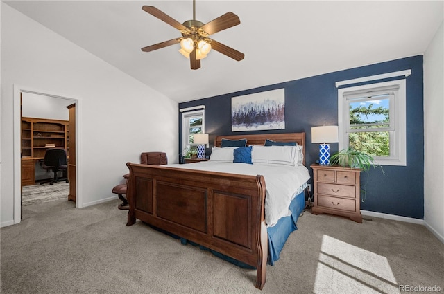 17815 Saddlewood, Monument, CO 80132 - bedroom with light colored carpet, an office area, vaulted ceiling, a spacious closet, and a ceiling fan