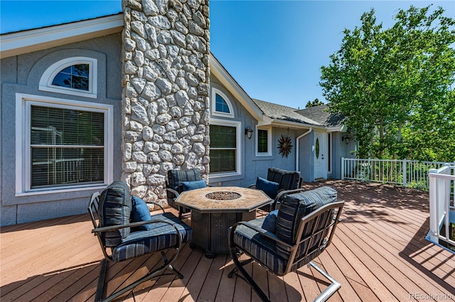 17815 Saddlewood, Monument, CO 80132 - wooden terrace featuring an outdoor fire pit