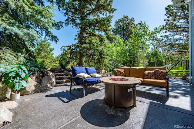 17815 Saddlewood, Monument, CO 80132 - view of patio / terrace featuring an outdoor living space with a fire pit