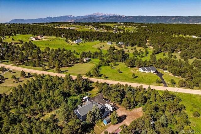 17815 Saddlewood, Monument, CO 80132 - view of property location with a mountain backdrop and a forest
