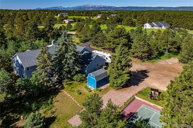 17815 Saddlewood, Monument, CO 80132 - view from above of property featuring a heavily wooded area and a mountainous background