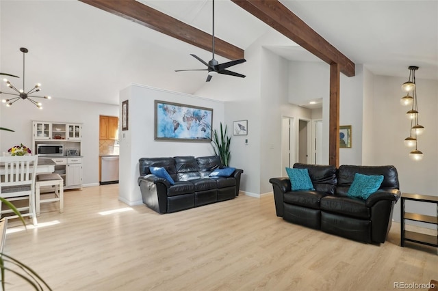 living room featuring ceiling fan with notable chandelier, beam ceiling, and light hardwood / wood-style floors