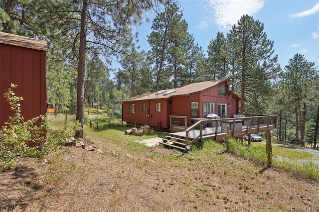 view of yard featuring a wooden deck