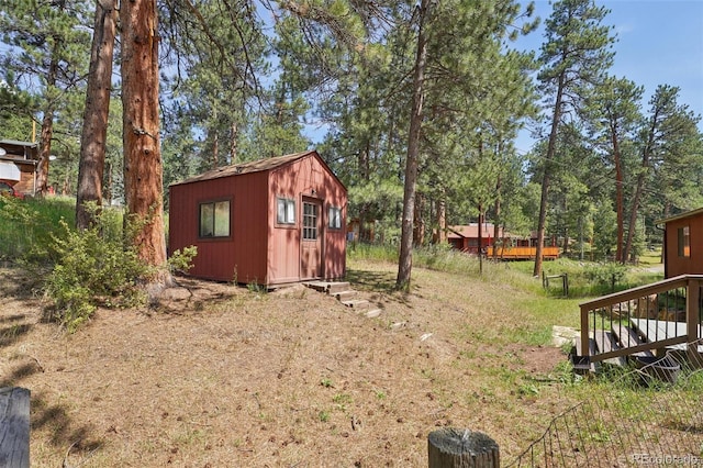 view of yard with an outdoor structure and a deck