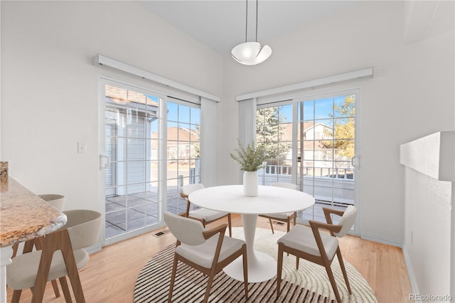 dining space featuring light hardwood / wood-style flooring