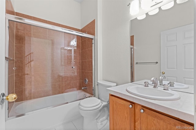 full bathroom featuring bath / shower combo with glass door, vanity, and toilet