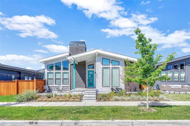 contemporary home featuring central air condition unit