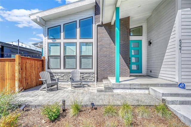 view of exterior entry featuring a porch