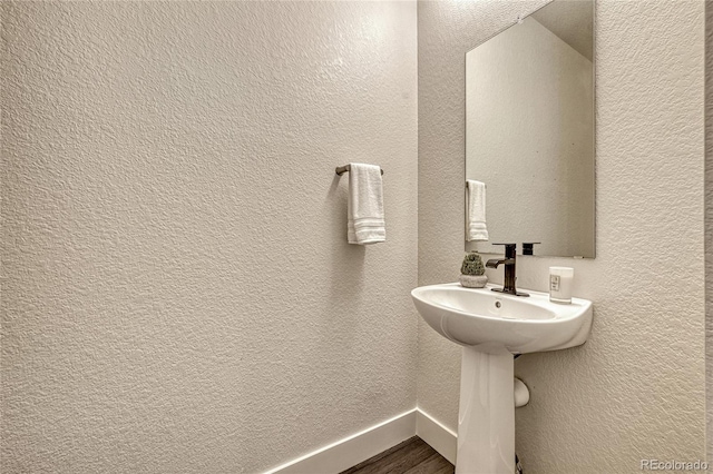 bathroom featuring hardwood / wood-style flooring