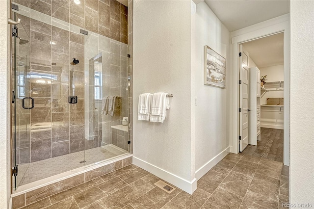 bathroom featuring an enclosed shower