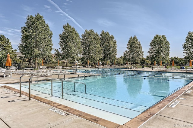 view of swimming pool with a patio