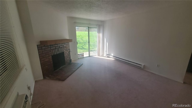 unfurnished living room with a textured ceiling, a baseboard radiator, a brick fireplace, and light colored carpet