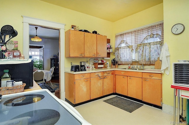 kitchen featuring pendant lighting and sink