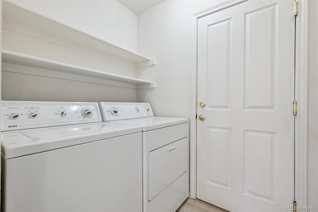 laundry area with independent washer and dryer