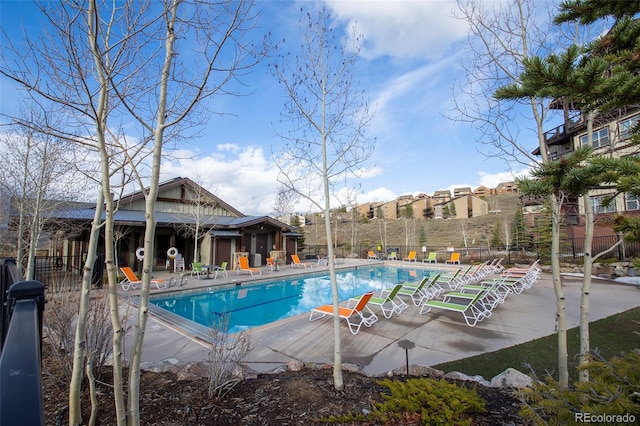 view of swimming pool featuring a patio