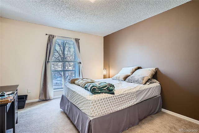 carpeted bedroom with a textured ceiling