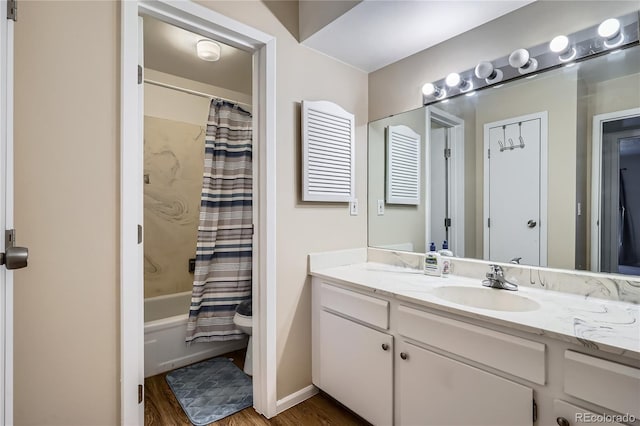 full bathroom with wood-type flooring, toilet, vanity, and shower / tub combo with curtain